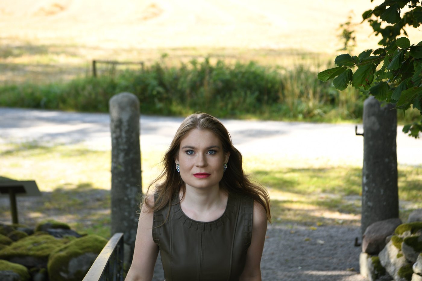 Karolina Bengtsson at a gate in the countryside